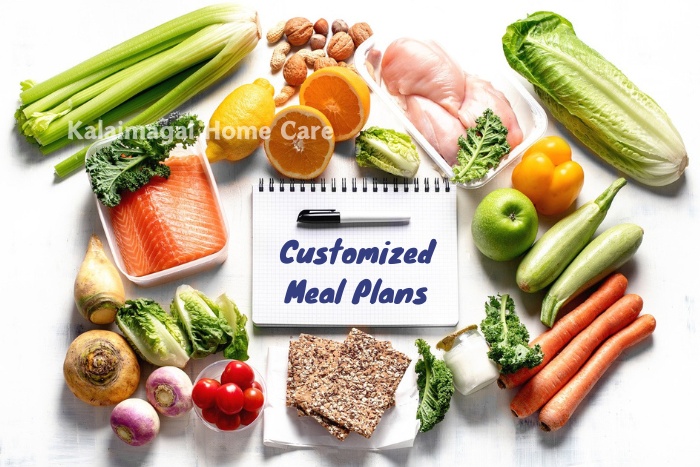 Assortment of fresh, healthy ingredients surrounding a notepad labeled "Customized Meal Plans," highlighting the personalized dietary planning services offered by Kalaimagal Home Care in Coimbatore.