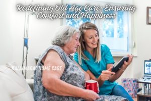 A compassionate caregiver from Kalaimagal Home Care in Coimbatore assisting an elderly woman at home. The caregiver and the elderly woman share a warm moment, enhancing comfort and happiness in old age care. The woman is holding a tablet and a red mug, showcasing personalized care and digital engagement