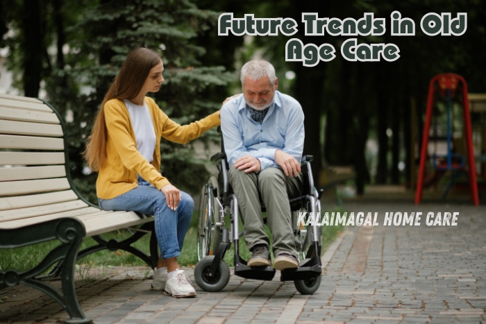 Young woman providing comfort to an elderly man in a wheelchair at a park bench, representing future trends in old age care. The image showcases compassionate elderly care services offered by Kalaimagal Home Care in Coimbatore