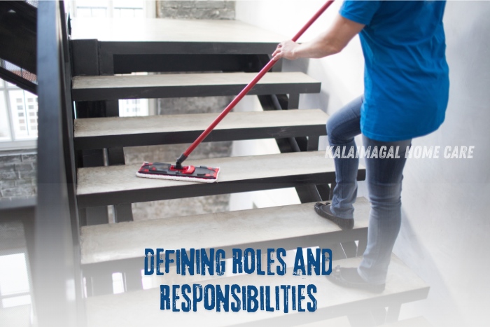 A professional cleaner in a blue shirt mopping a staircase, demonstrating the importance of defining roles and responsibilities in maintaining a clean and organized environment. Kalaimagal Home Care ensures clear communication and efficient housekeeping services in Coimbatore.